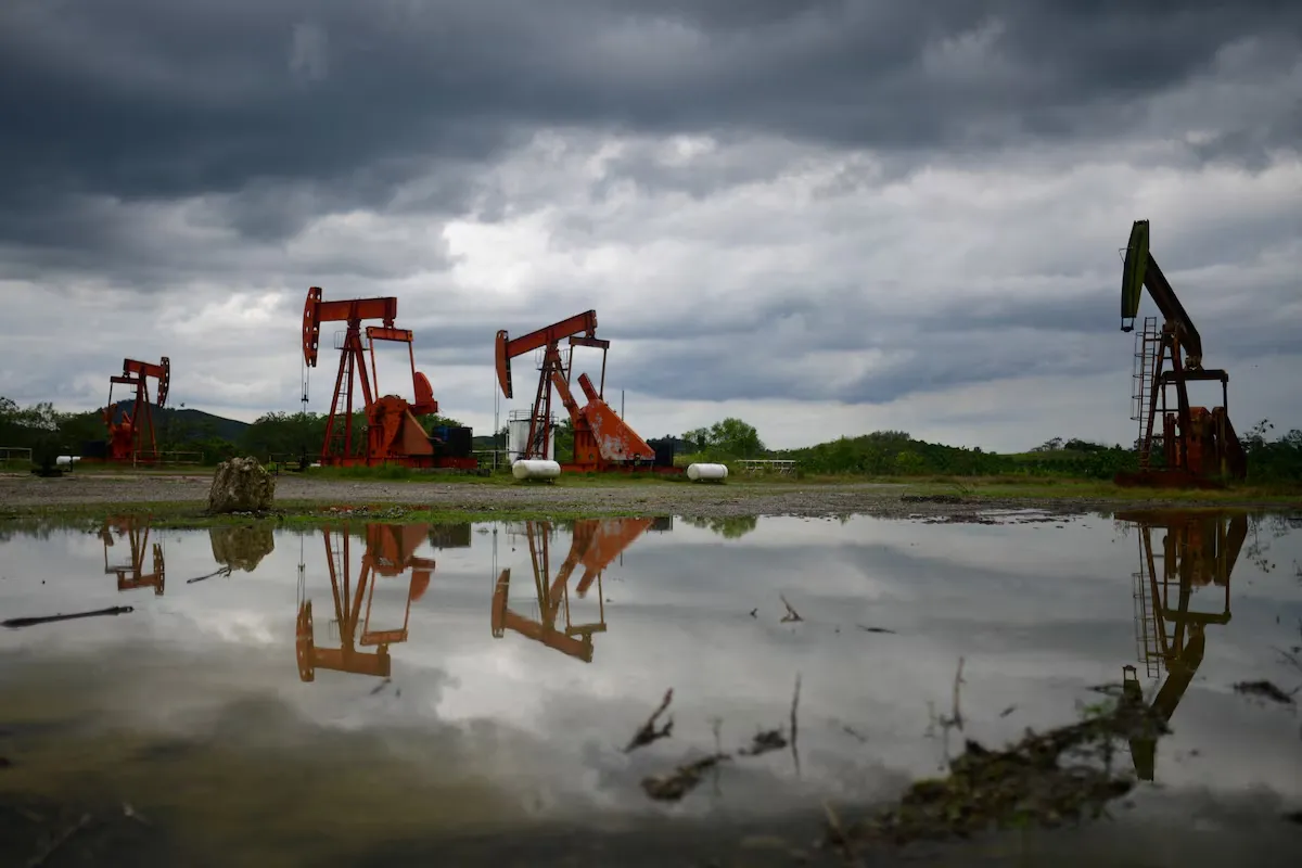 Oil prices have risen to a two-week high amid delays in negotiations with Iran