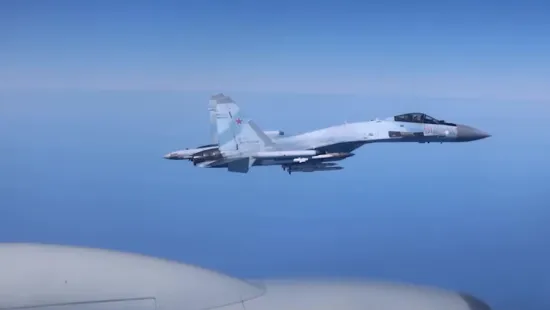 A Russian fighter jet flew just a few metres away from a British reconnaissance aircraft over the Black Sea