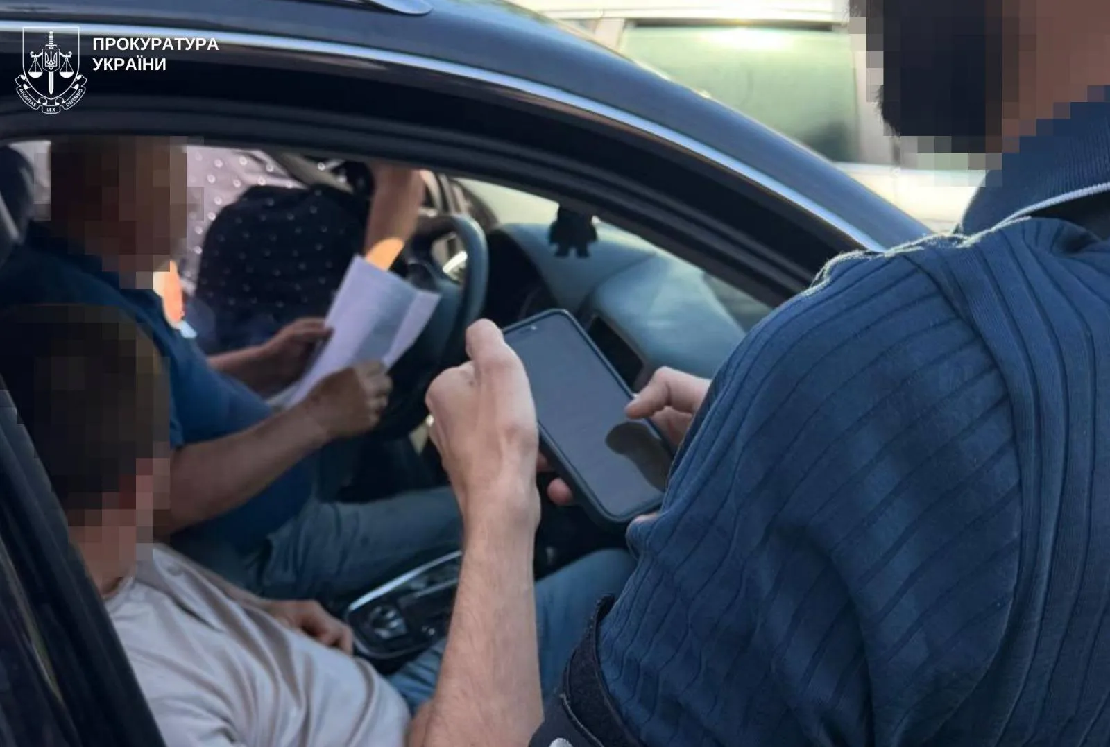 A former MP and his son have been arrested in Lviv on suspicion of organising a scheme to facilitate travel abroad